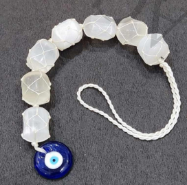 Selenite polished tumble stone hanging with evil eye pendant